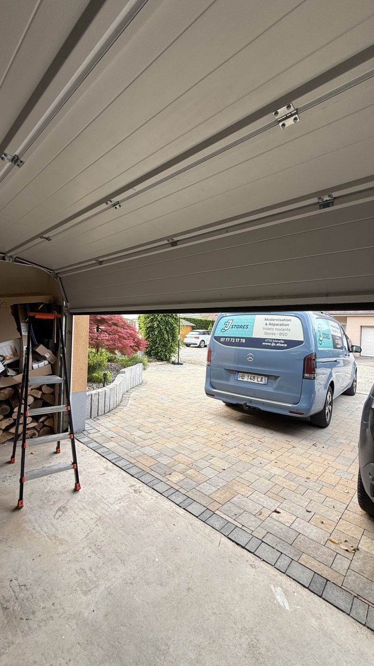 Réparation d’une porte de garage sectionnelle changement des ressort de torsion à Boofzheim à coté de Benfeld